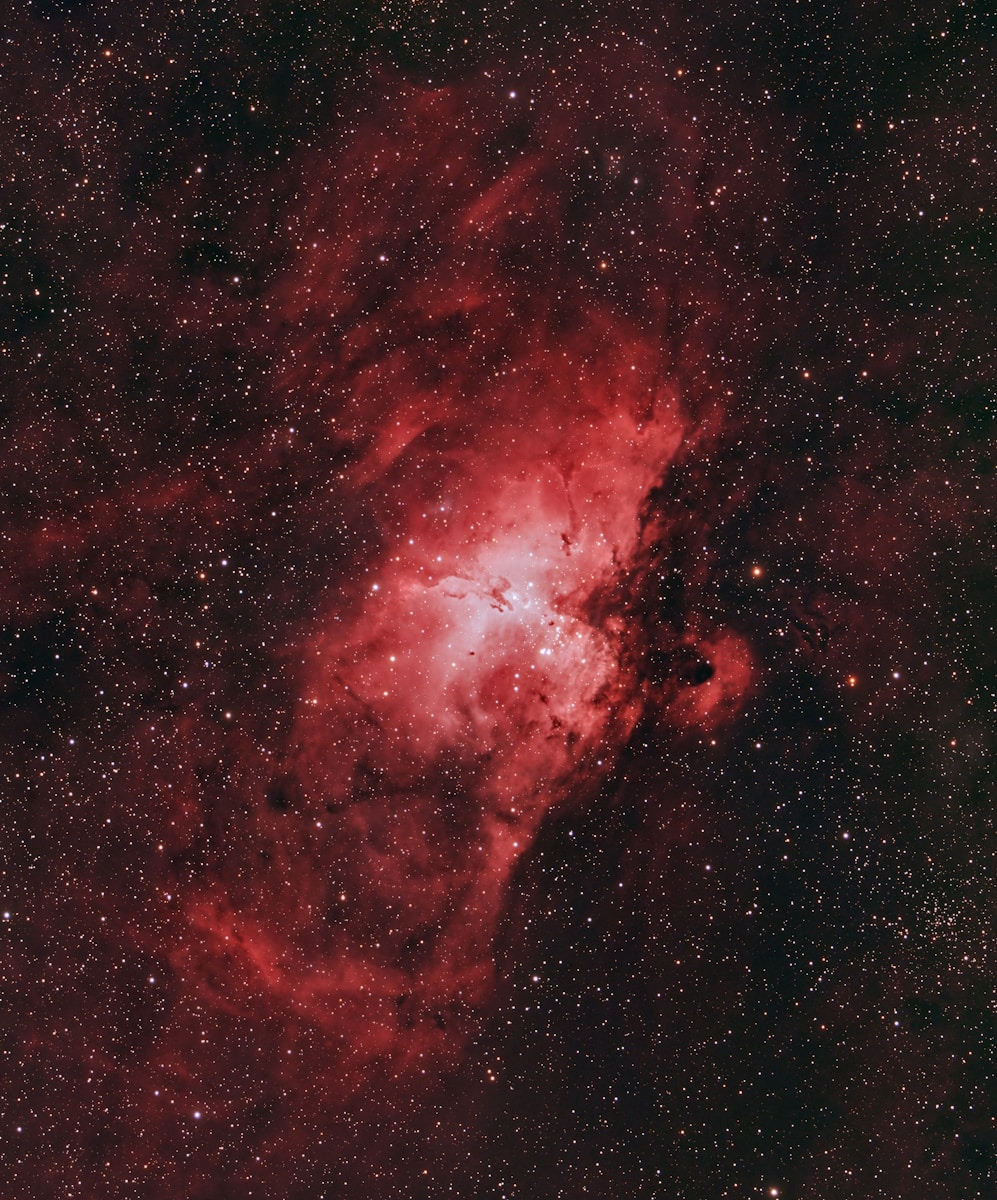 A large red object in the middle of a dark sky